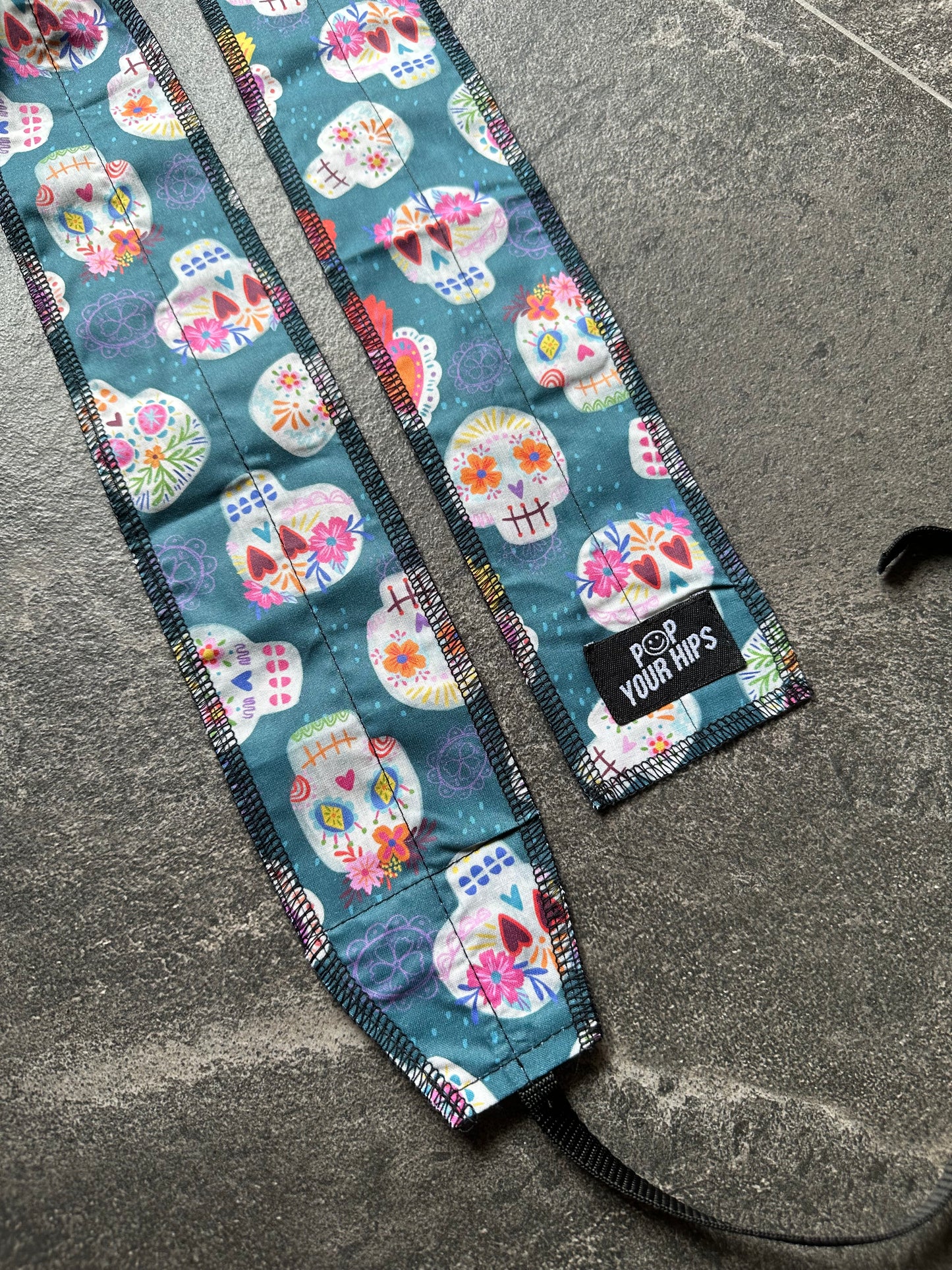 Teal skulls wrist wraps