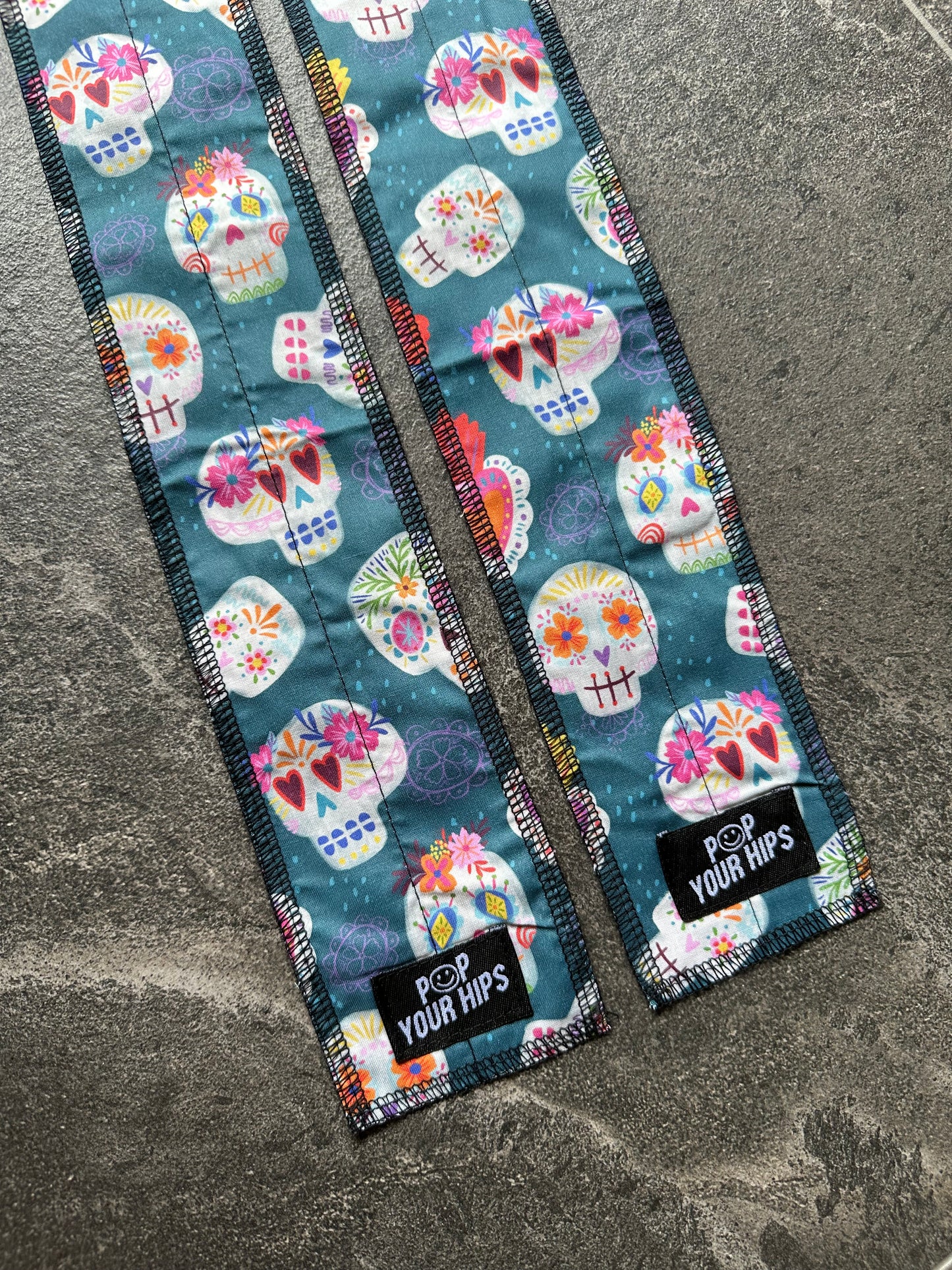 Teal skulls wrist wraps